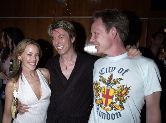 Minogue, Bowie and Cook in 2002.jpg