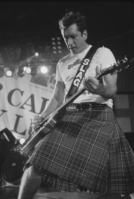 Steve Jones in Scottish Gents Kilt at 1996 Reunion Tour.jpg