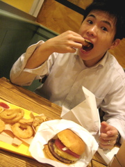 okie eating a hamburger