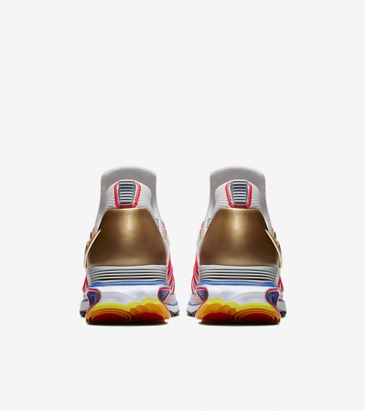 gold nike shox gravity