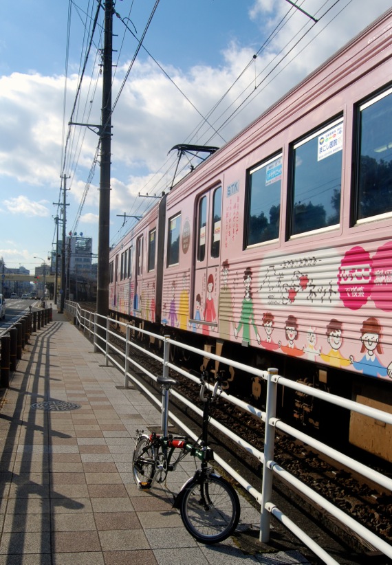 A brompton bike parked near Shizu-tetsu Kasuga station