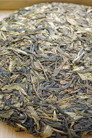 弯弓の黄片の餅茶2012年プーアル茶