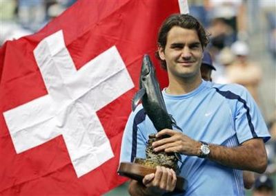 Roger Federer of Switzerland holds the championship trophy after defeating James Blake, 7-5, 6-3, 6-0, at the Pacific Life Tennis Open in Indian Wells, Calif. Sunday, March 19, 2006.