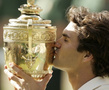 LONDON - JULY 09: Roger Federer of Switzerland kisses the trophy after winning the Men's final against Rafael Nadal of Spain on day thirteen of the Wimbledon Lawn Tennis Championships at the All England Lawn Tennis and Croquet Club on July 9, 2006 in London, England. (Photo by Phil Cole/Getty Images)