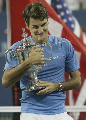 Roger Federer of Switzerland poses with the championship trophy after defeating Andy Roddick in the men's final of the U.S. Open