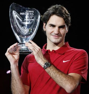 Roger holds his trophy