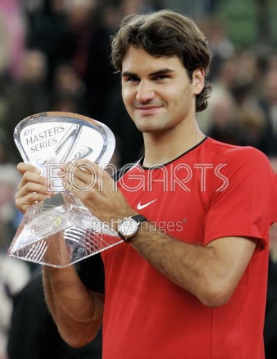 HAMBURG, GERMANY - MAY 15: Roger Federer of Switzerland celebrates winning his match against Richard Gasquet of France during the final of the Masters Series Hamburg at Rothenbaum on May 15, 2005 in Hamburg, Germany. (Photo by Alexander Hassenstein/Bongarts/Getty Images) 