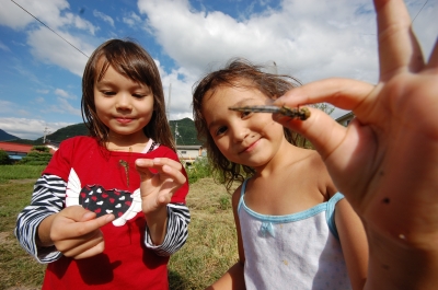 Girls show off dragon flies